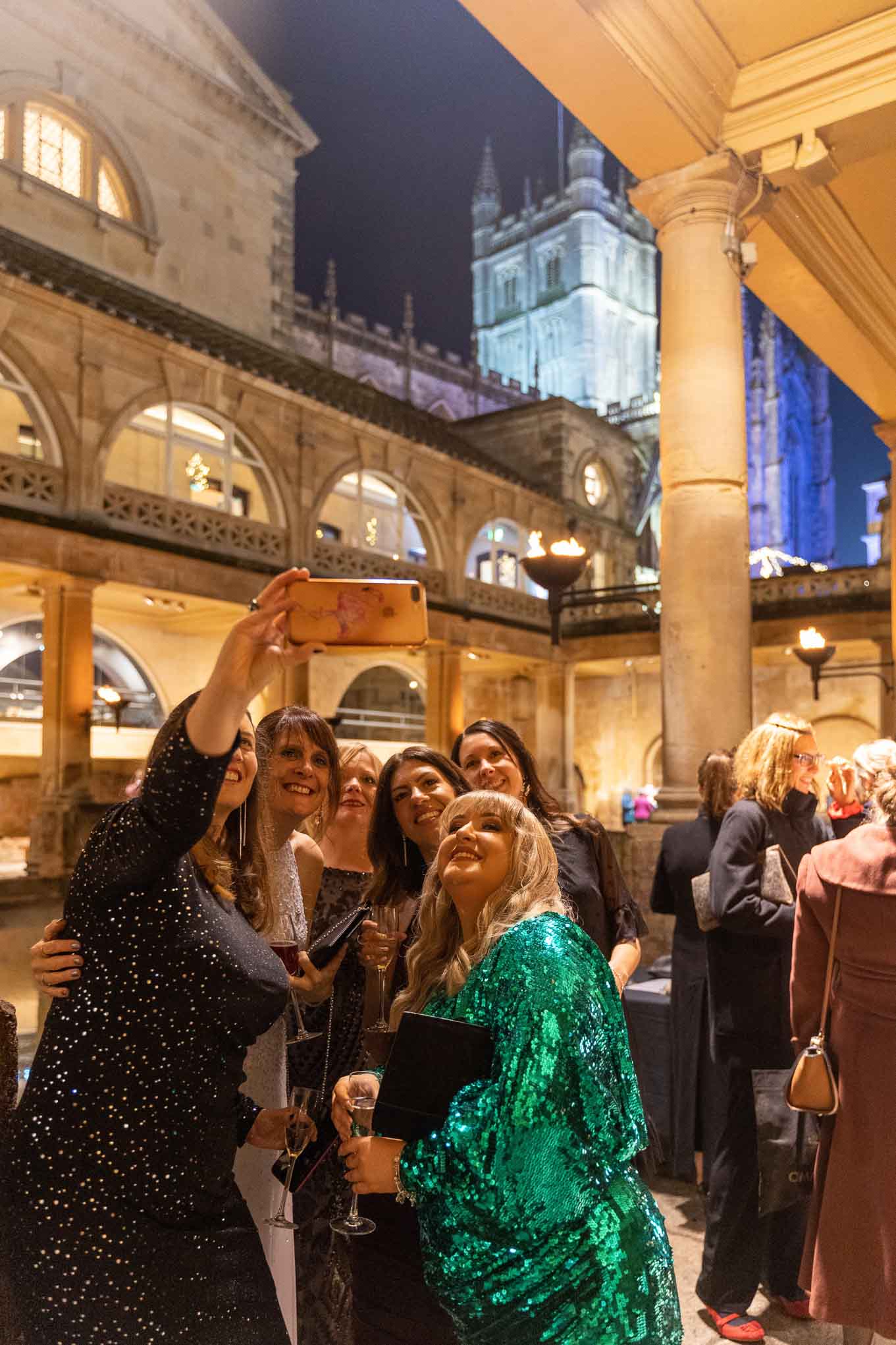 Party guests taking a selfie at the Roman Baths