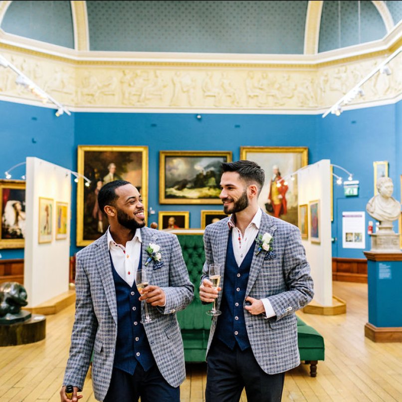 Image of gay couple enjoying their wedding in the Victoria Art Gallery