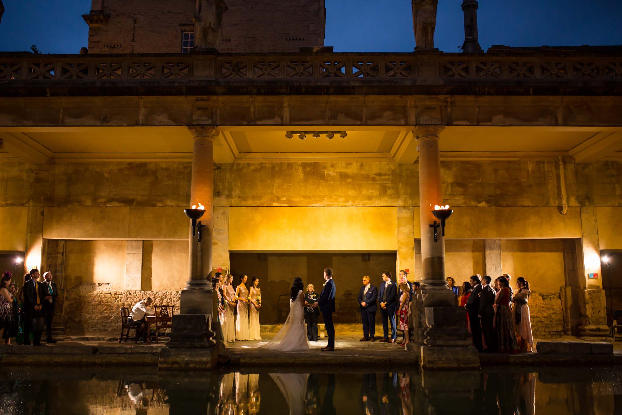 View of wedding ceremony across the Great Bath