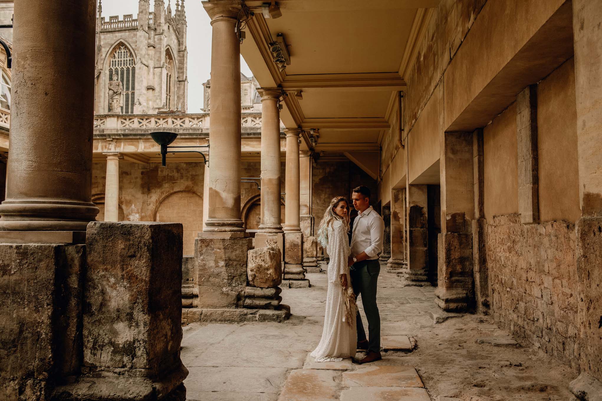 Wedding couple in the distance at the Roman Baths