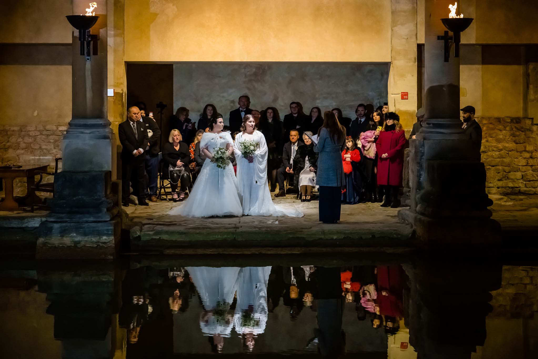 Couple exchanging vows in front of guests