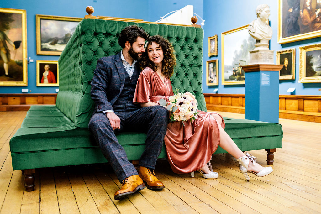 Couple sitting on a banquette in Upper Gallery