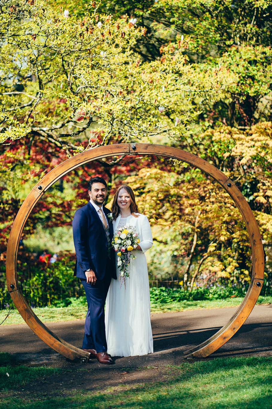 Wedding couple pose inside Moongate