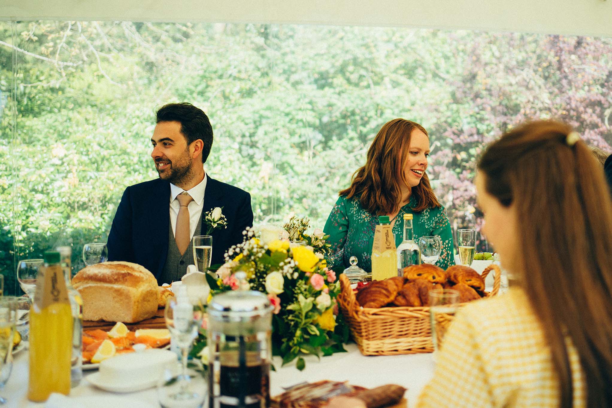 Wedding couple seated in marquee in the Botanical Gardens