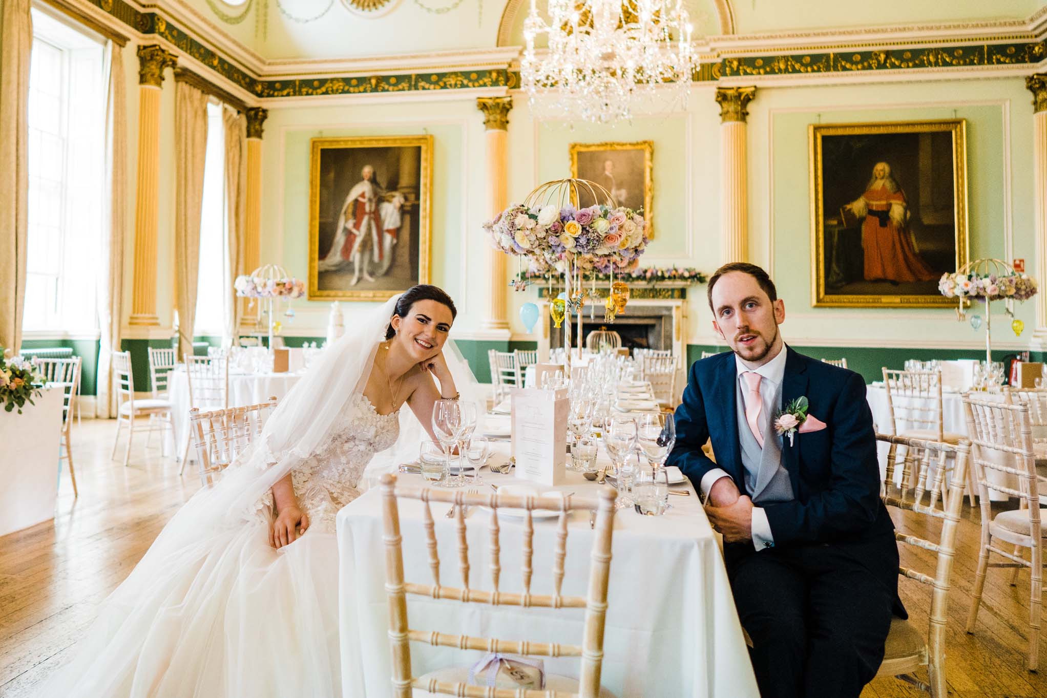 Wedding Couple seated at Reception table before guests arrive