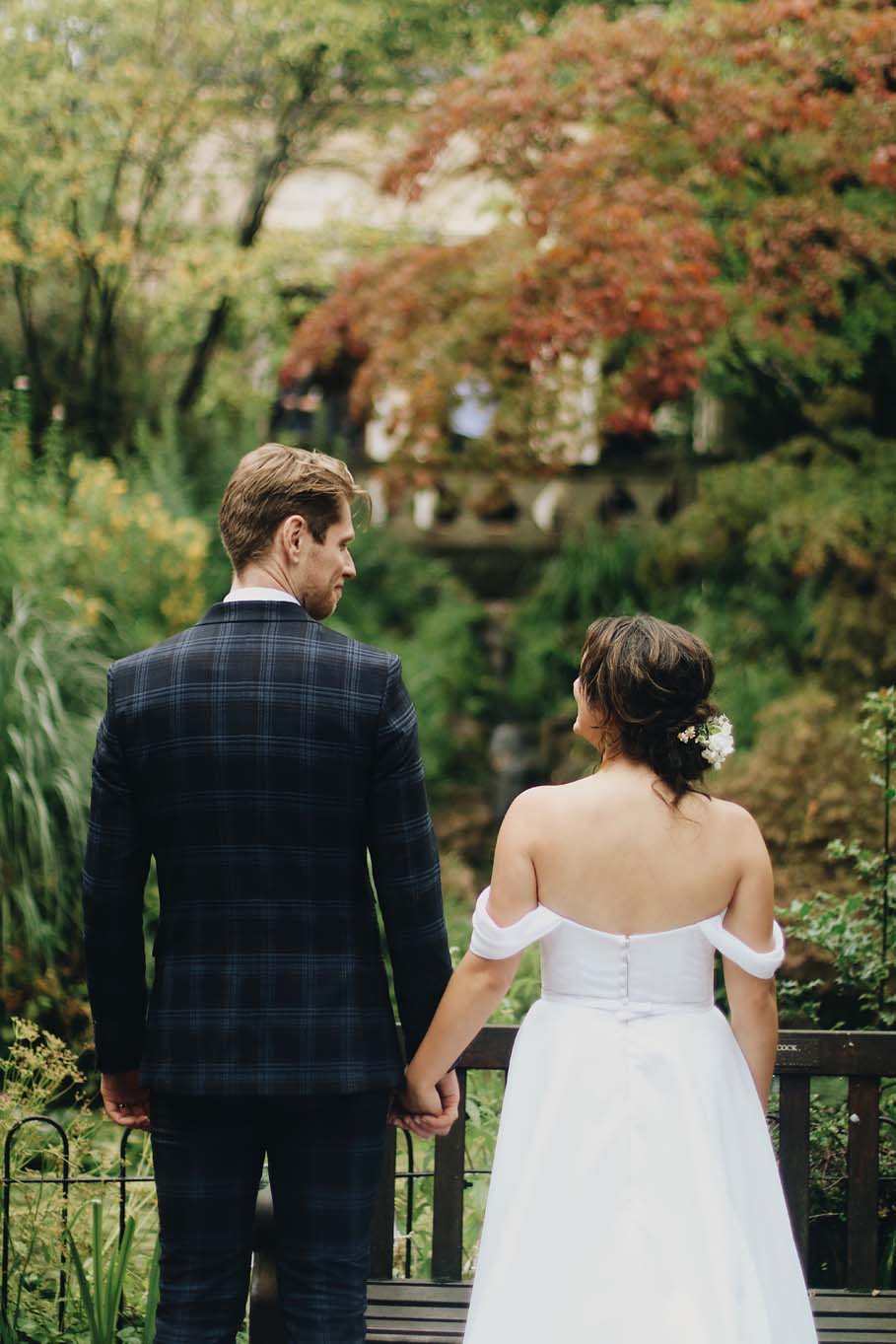 Wedding couple look towards Temple of Minerva