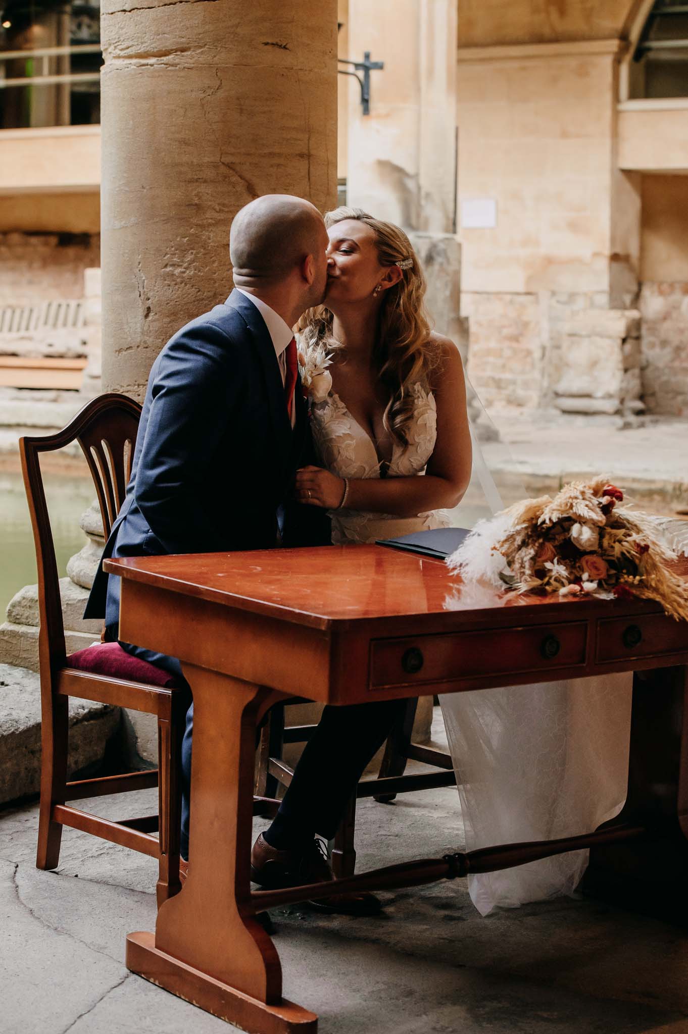 Couple kiss after signing register