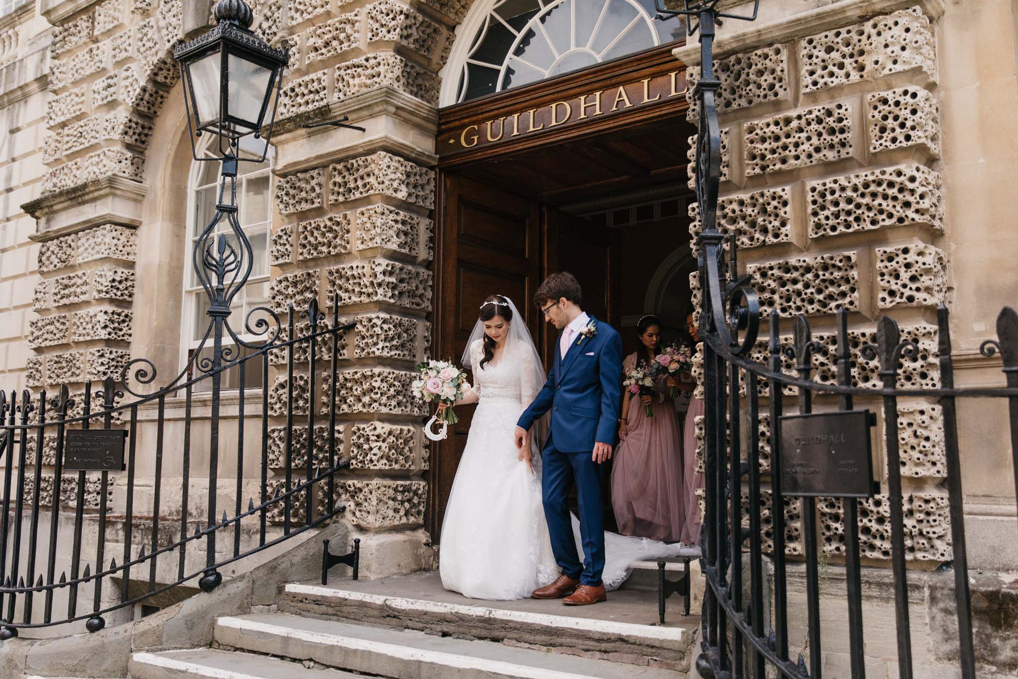 Wedding couple leave the Guildhall