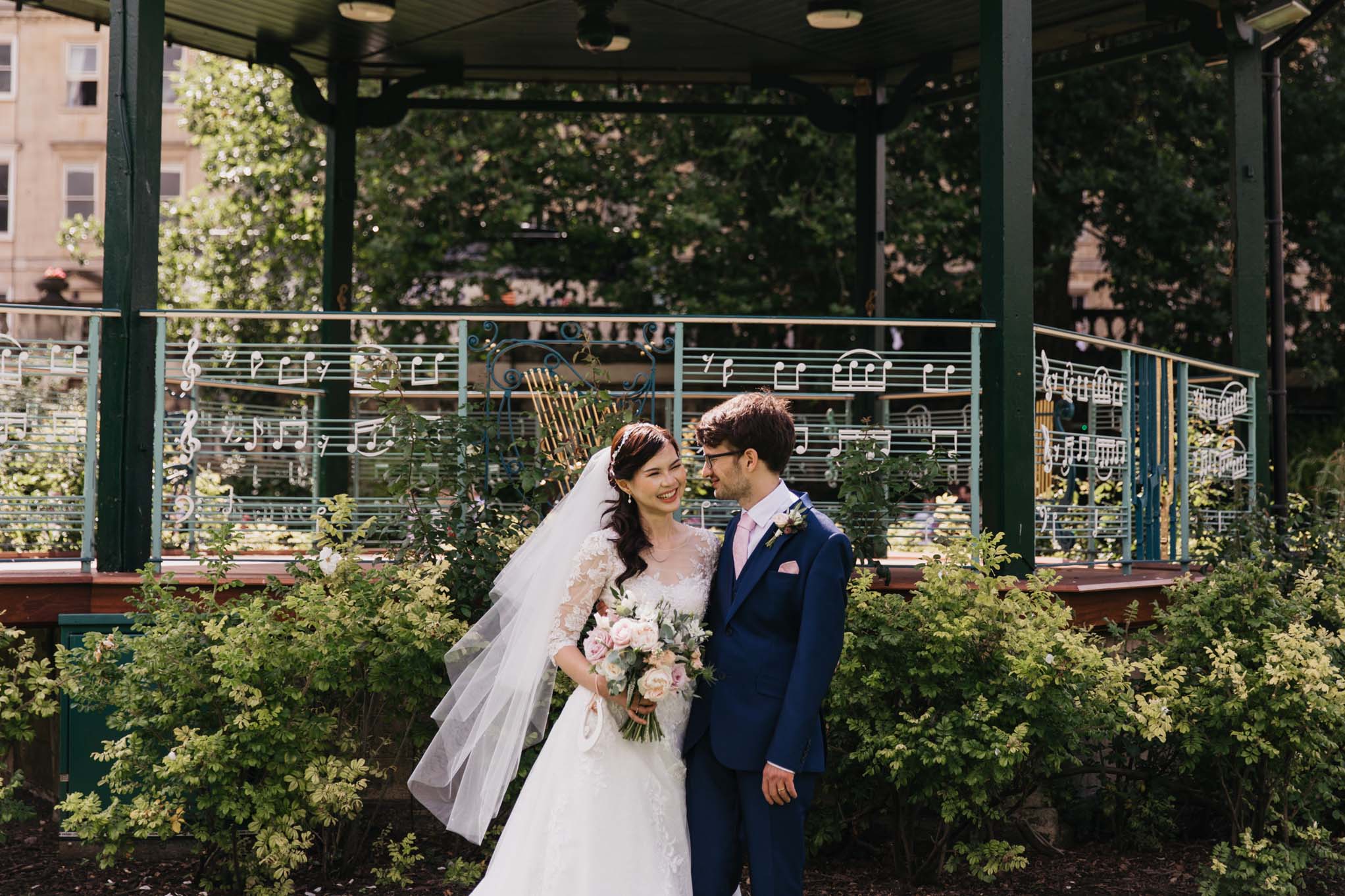 Couple stand in front of bandstand, Parade Gardens