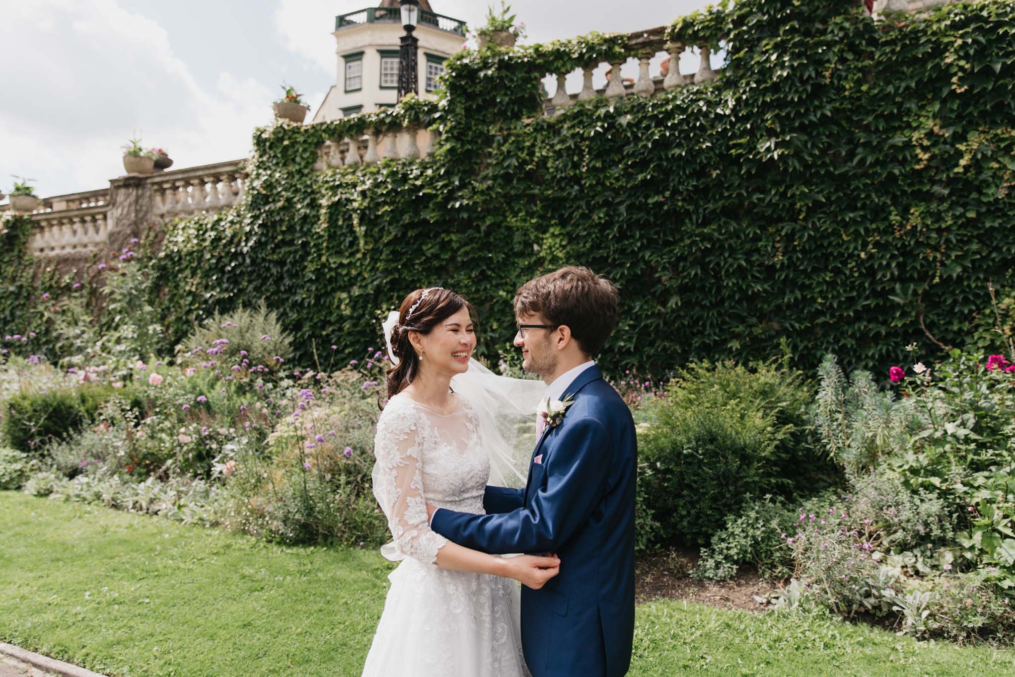 Wedding couple embrace in Parade Gardens