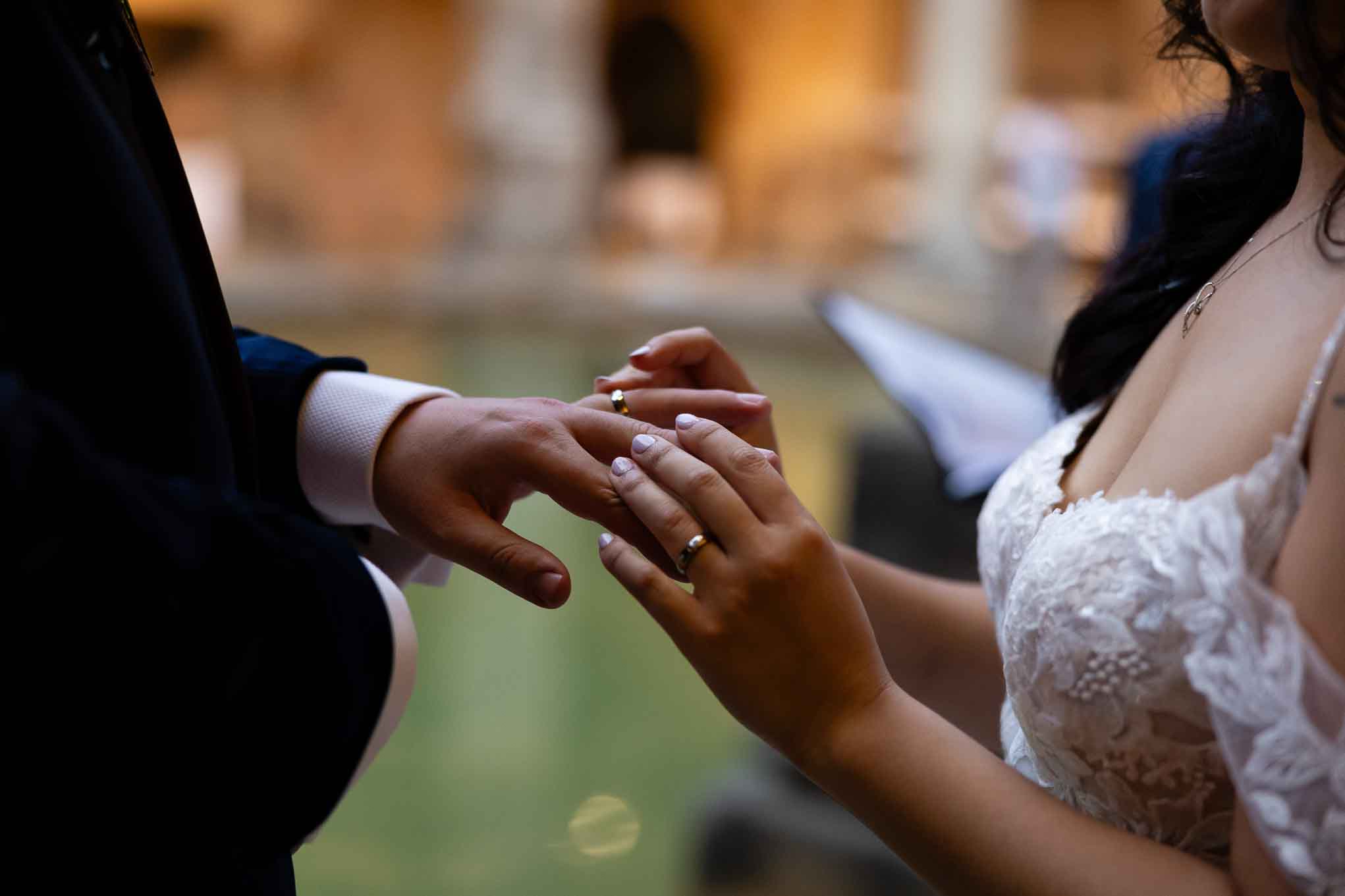 A couple exchange rings at the Roman Baths