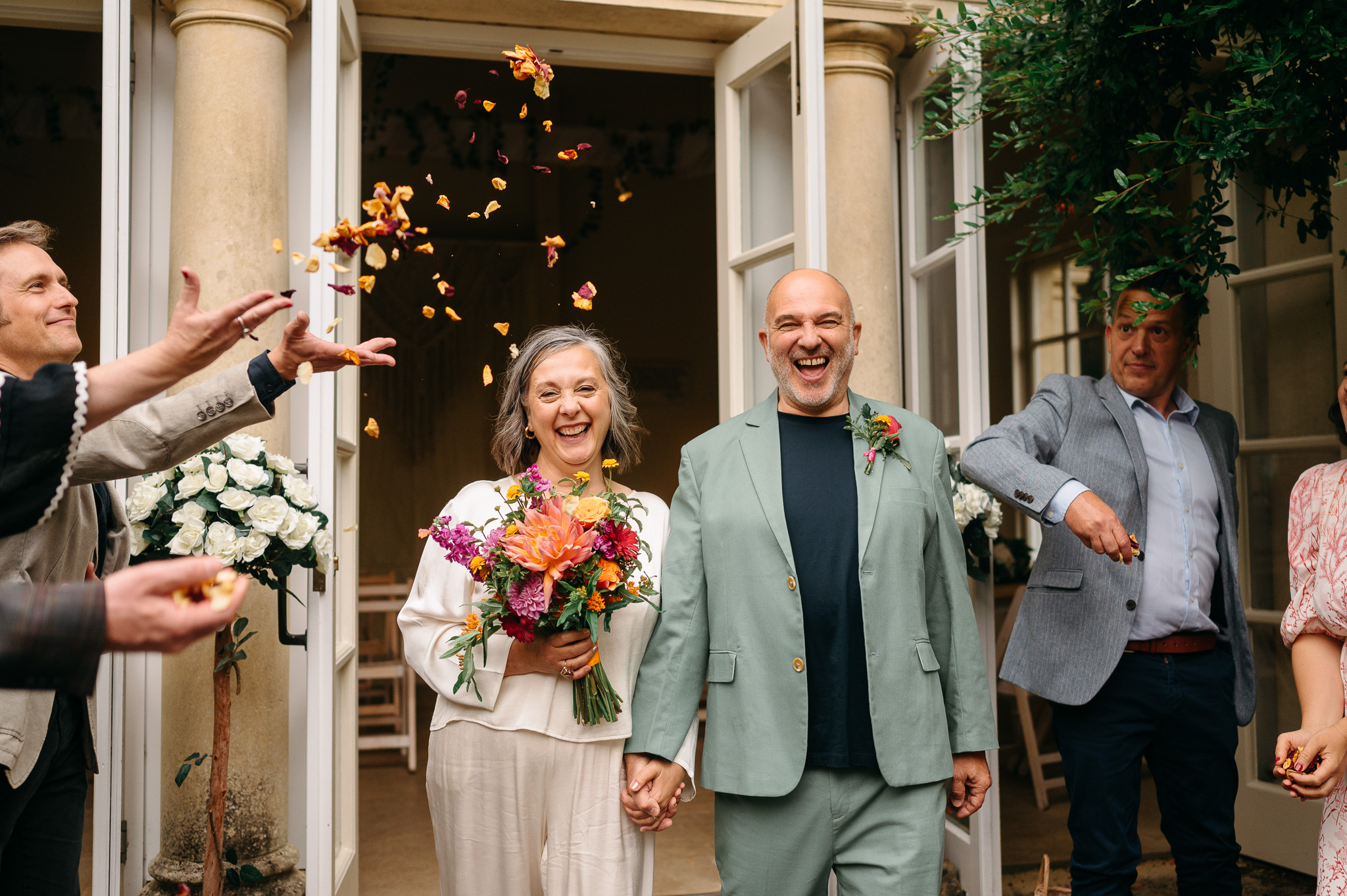 Confetti is thrown on wedding couple