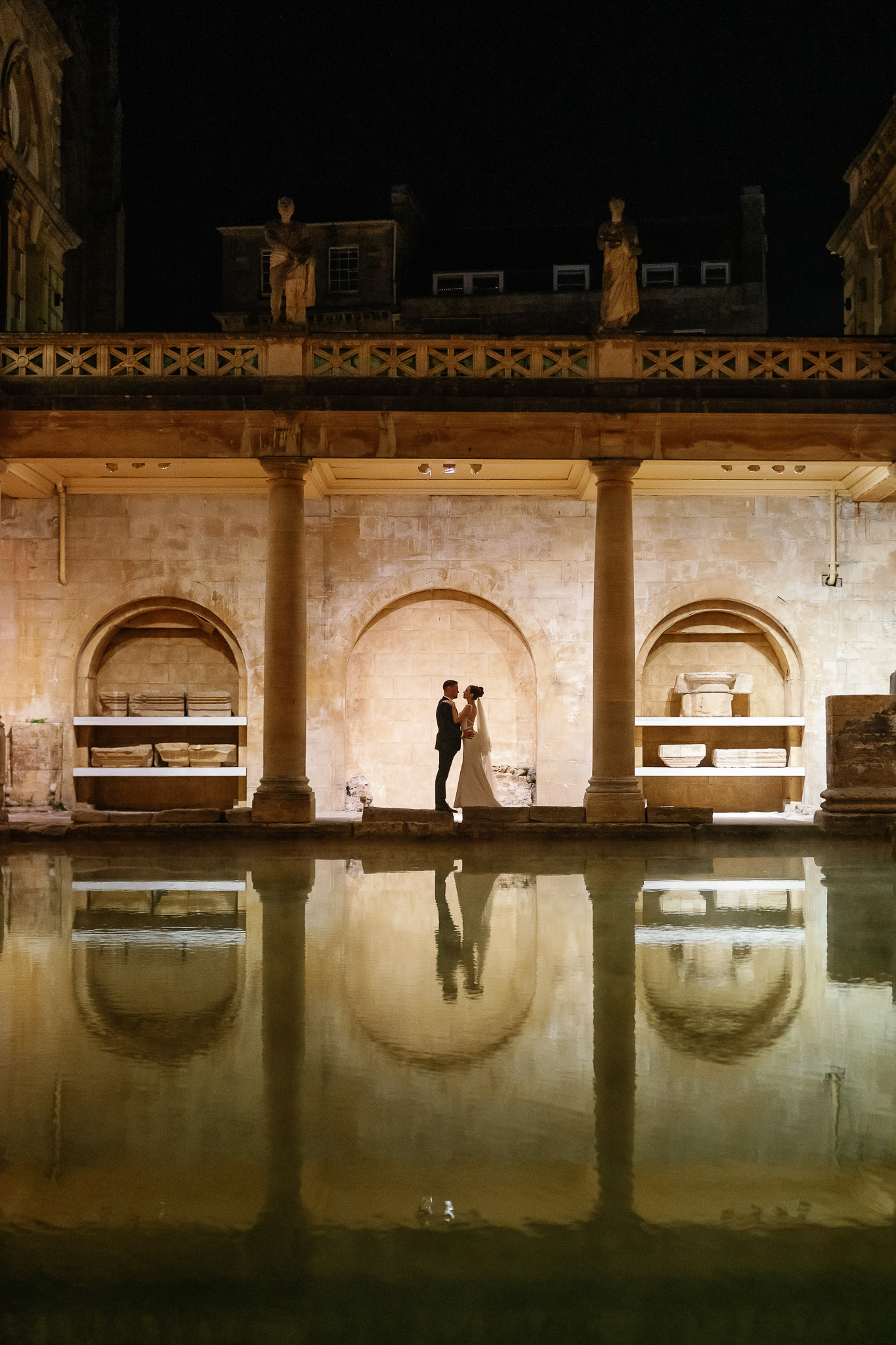 Wedding couple views across the Great Bath