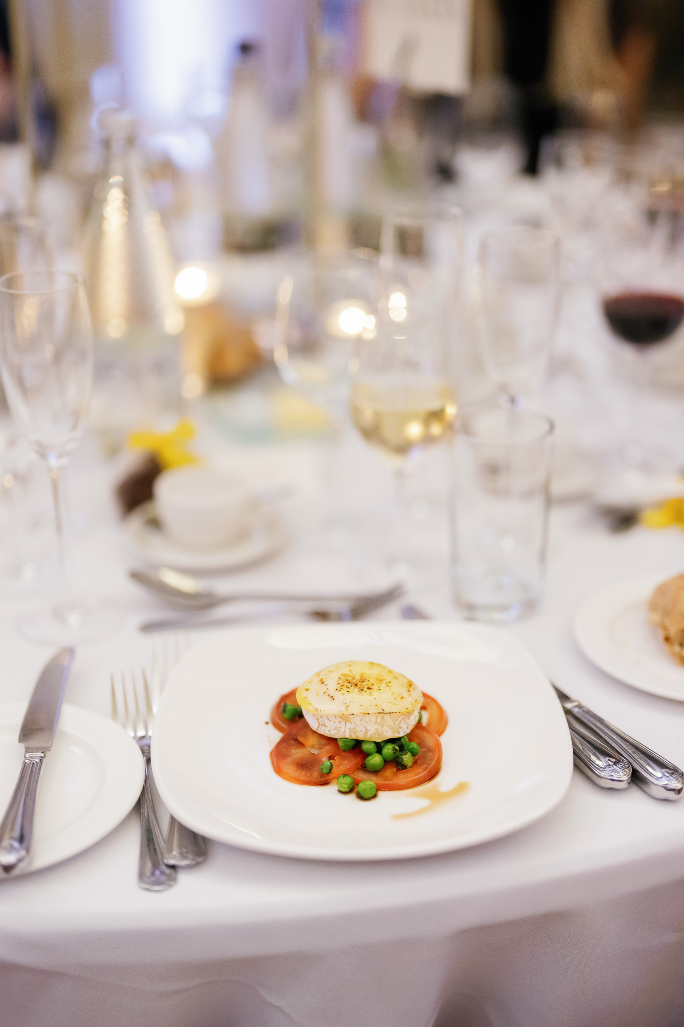 Grilled English goat’s cheese, vine tomato, minted pea, balsamic dressing