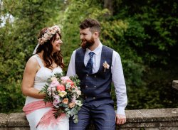 Wedding couple sit on bridge at the Temple of Minerva, A Tall Long Legged Bird