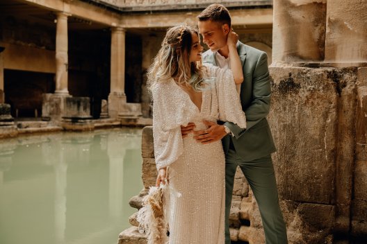 Wedding Couple embrace by the Great Bath, Emma-Jane Photography